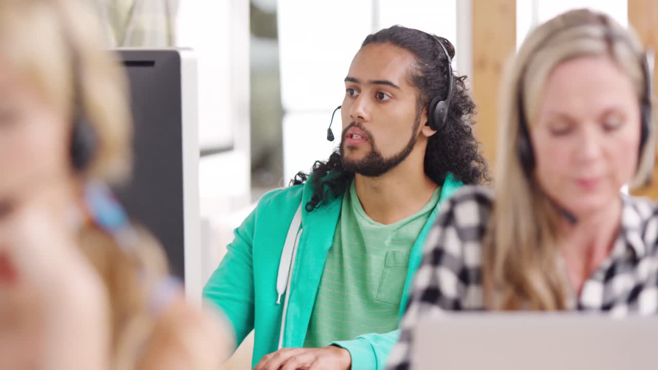 Call centre staff working in a modern office