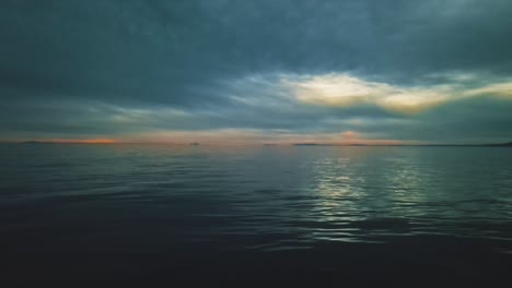 fixed shot over the calm sea with dramatic sky