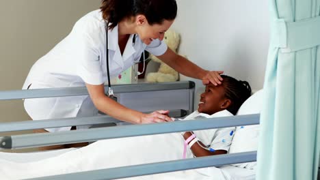 female doctor examining a sick girl