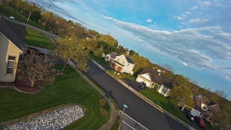 upscale american neighborhood with homes and private swimming pool in garden at sunset