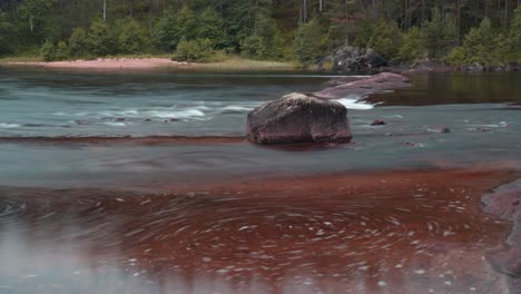 A-timelapse-of-the-fast-current-on-the-shallow-mountain-river-forming-eddies-and-whirlpools