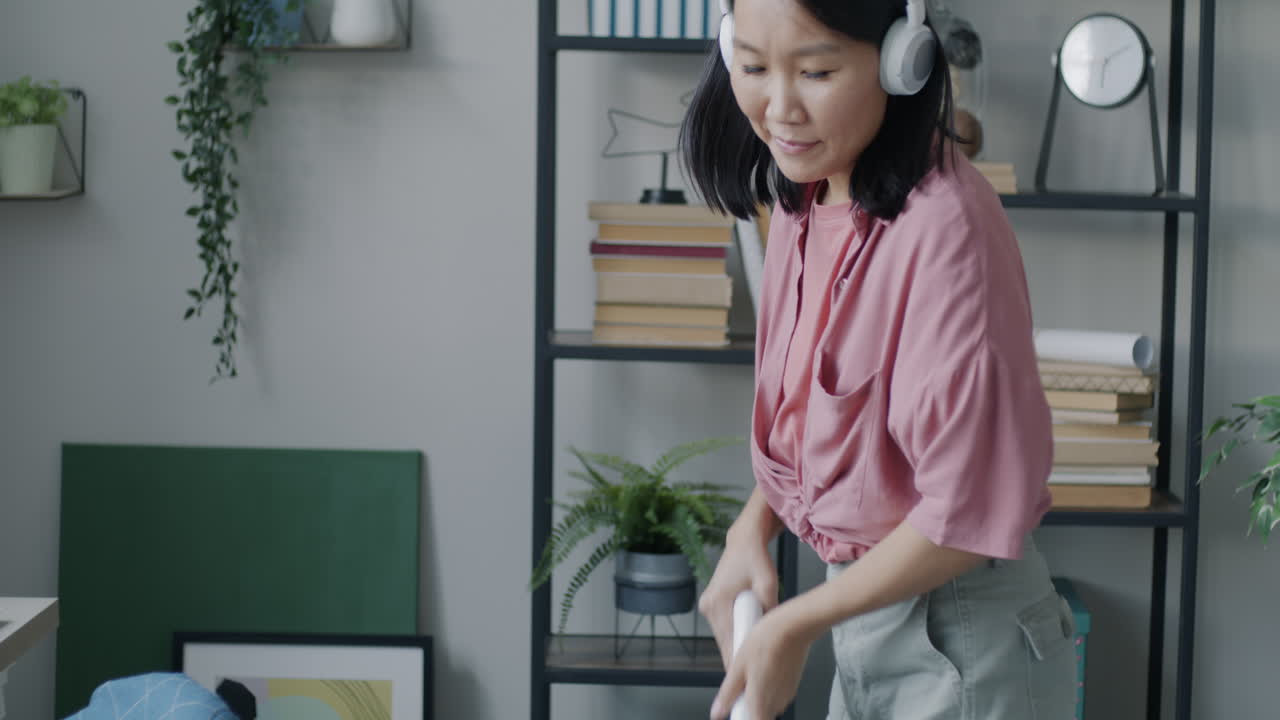 Woman Dancing at Home While Listening to Music