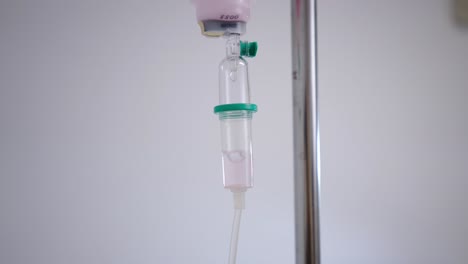 close-up of an iv drip in a hospital setting