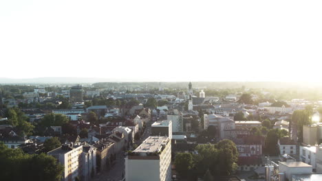 aerial footage of rosenheims with a nice parallax of theskyline flying from right to left, showing industrial-, residential-areas,churches, the mountains in the distance giving a beautifulstructure