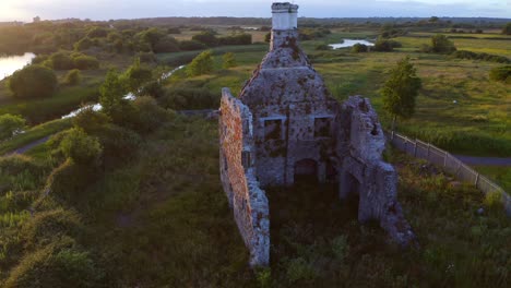 Aerial-parallax-of-Terryland-Castle-on-River-Corrib,-Galway-Ireland,-exposing-interior-walls