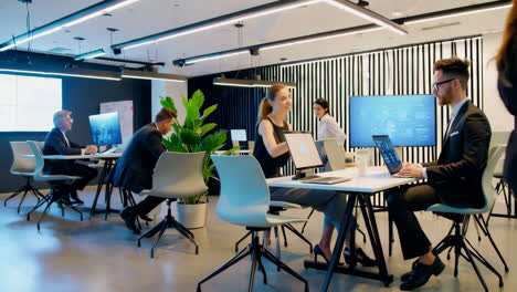business professionals working in a modern open-plan office