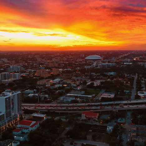 orange bright burning skies at sunset above the vast urban scenery. panorama of miami, florida, usa at sundown.