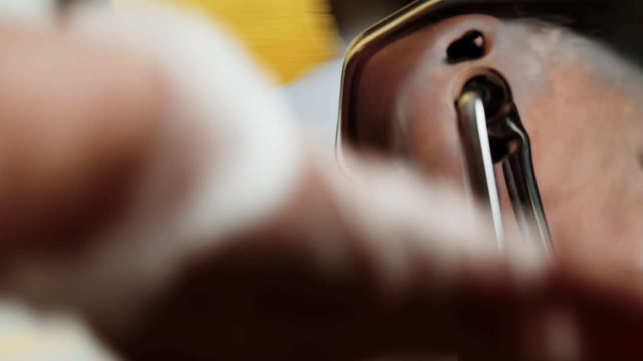 Close-up of Hand Rolling Fresh Pasta Dough with Machine