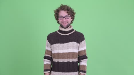 young handsome bearded man with curly hair