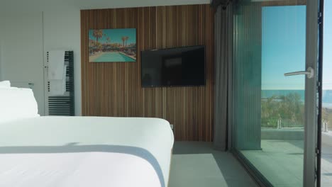 right to left view from balcony with sea view to a comfortable bedroom