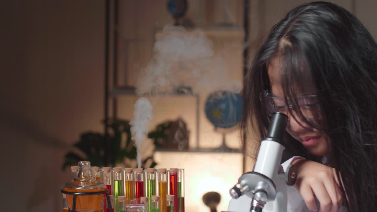 Young Scientist Girl With Dirty Face Looking At Microscope And Thinking In Laboratory