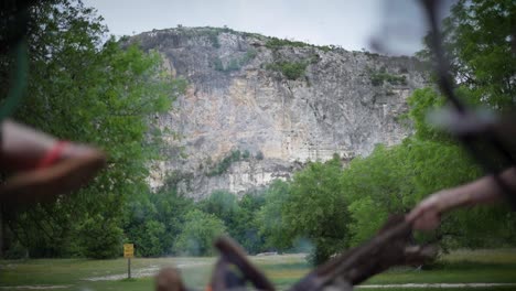 campfire in the texas hill country at a campsite along the nueces river at chalk bluff park