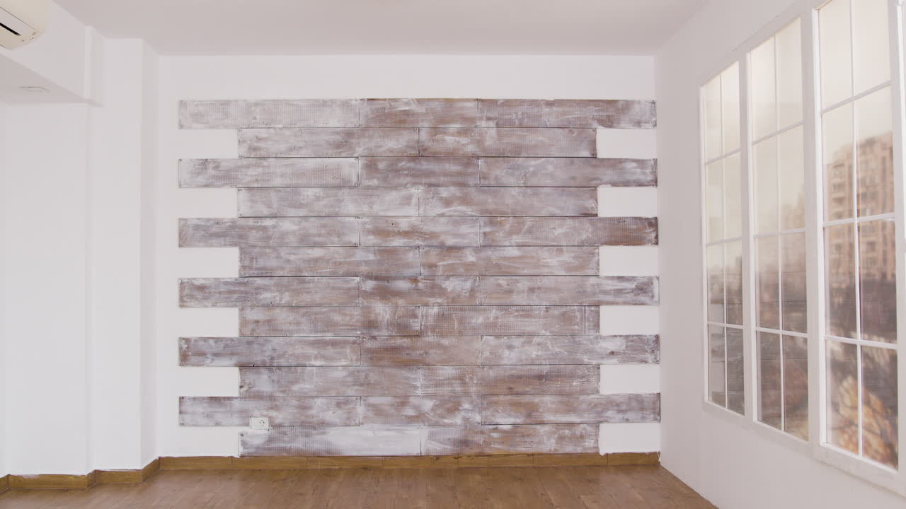 Interior of a room with a window and wooden wall