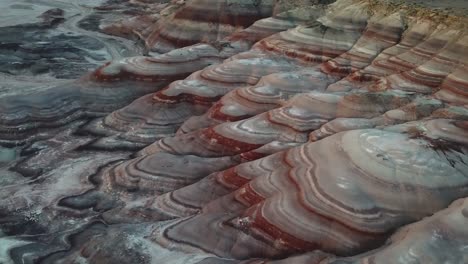 striped sandstone hills and dry canyon in utah desert, usa