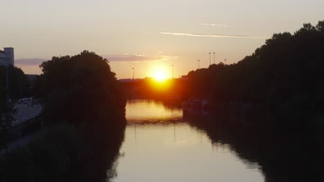 saar river germany, saarbrucken city, sky reflexion in water at sunset