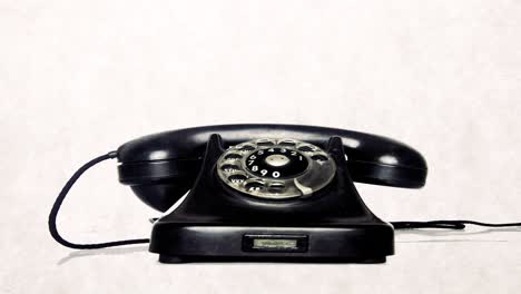 the vintage black phone comes and rings and then leaves loop