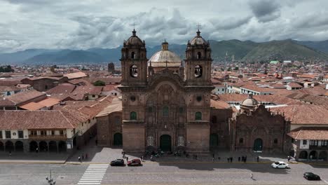 establishing aerial fly drone view of cusco, peru with chatedral and main square