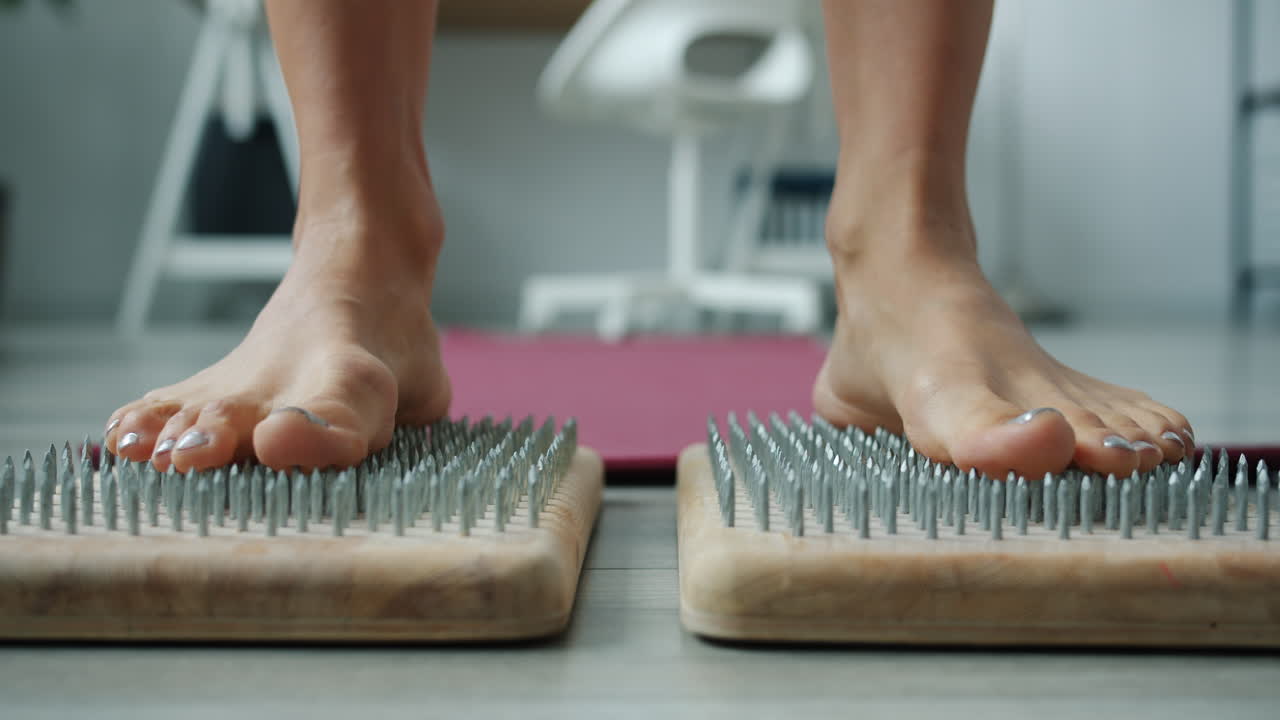 Feet on a Nail Mat for Reflexology