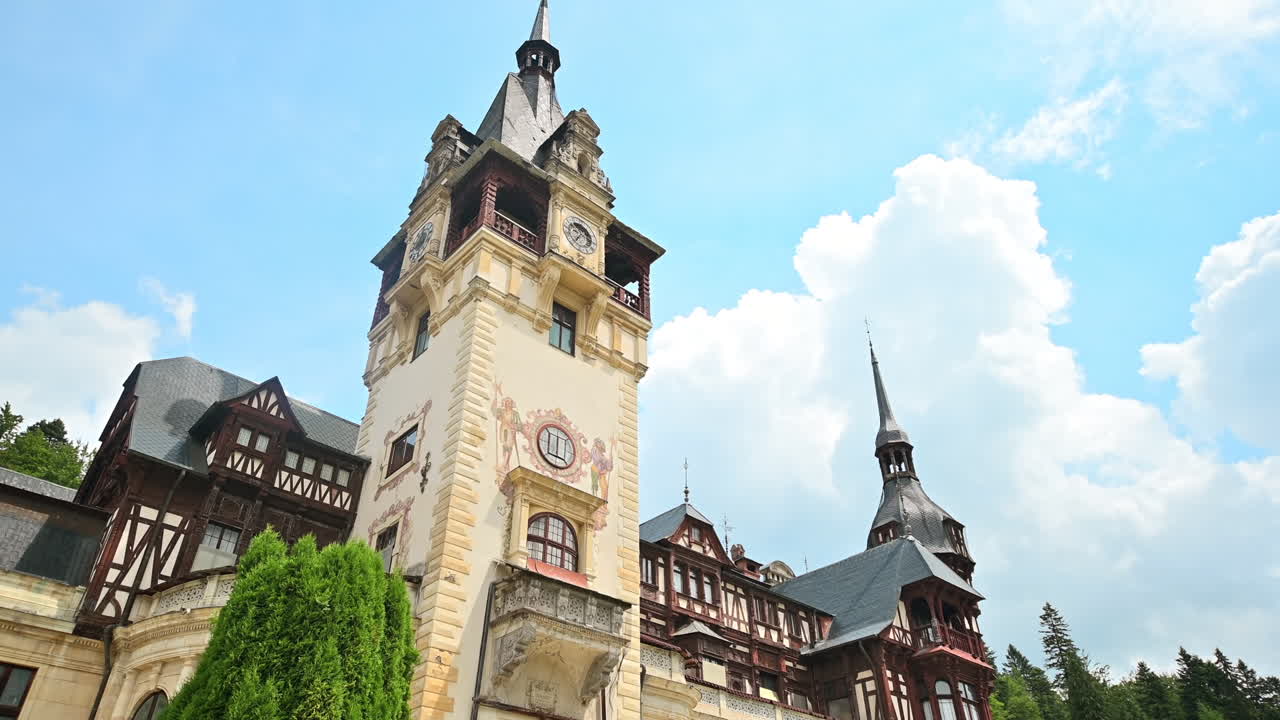 View of The Peles Castle in Romania. Castle with gardens and statues