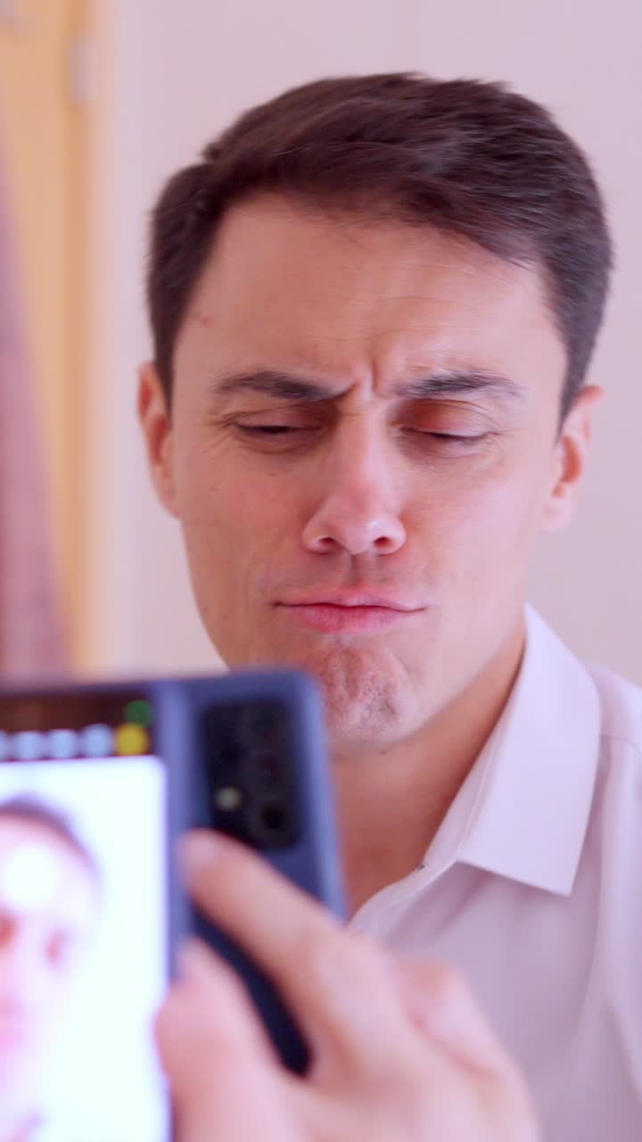 Narcissistic man taking selfies in bathroom mirror