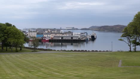 shot of a harbour and pier with trawler boats moored and anchored