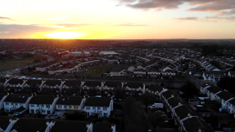 Aerial---A-residential-of-Lucan,-a-magic-hour-cold-day-with-a-sunset-view-from-above-of-the-houses-and-traffics