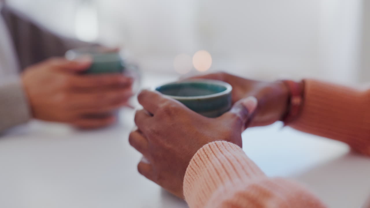 Tea, talking and hands of women together