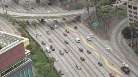 Overhead-Shot-Following-Cars-Moving-Through-Freeways-in-Downtown-LA