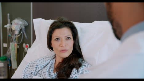 over shoulder view of patient having discussion with doctor