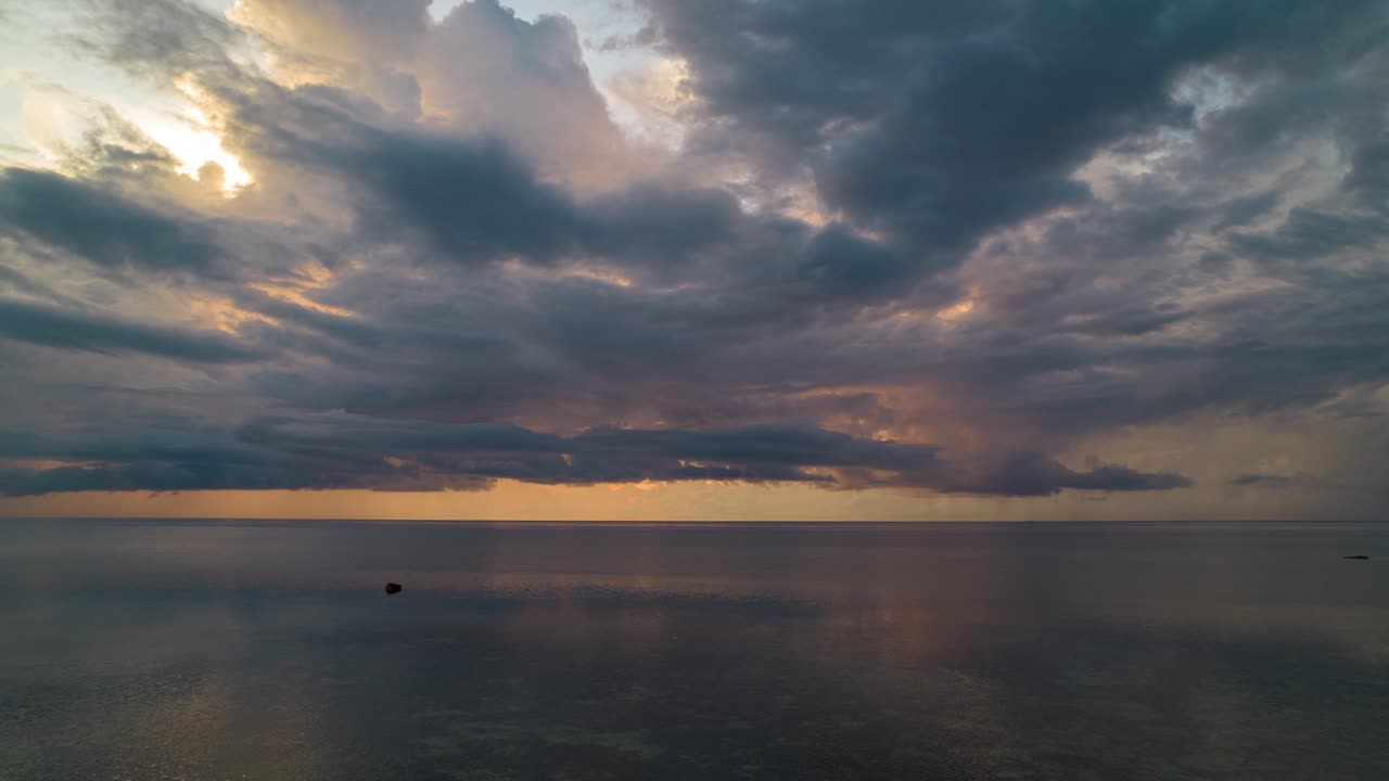 Aerial cinematic hyperlapse of a sunrise over the ocean