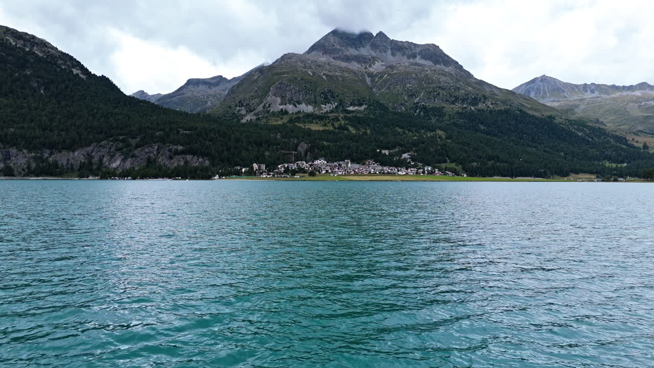 Tranquil Swiss lake with mountain view in Silvaplana, peaceful and scenic