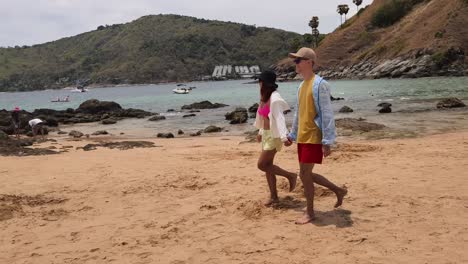 couple walking on a beautiful beach