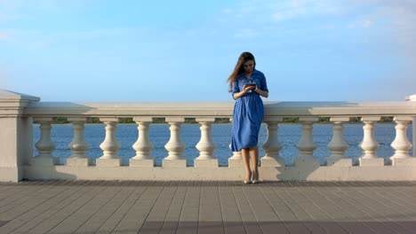 woman looking around then using digital tablet