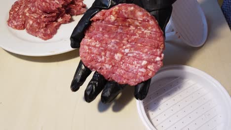 Hand-Preparing-Beef-Patty-For-Burger-At-The-Kitchen