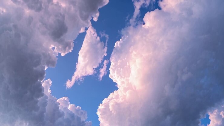 A video capturing dramatic clouds from a low angle, highlighting their fluffy texture