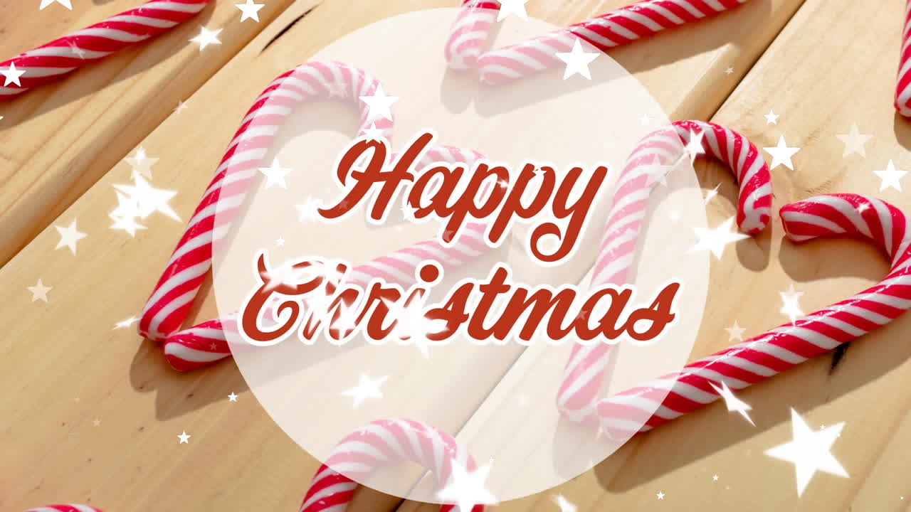 테이블 위에 떨어지는 별과 사탕 막대기 위에 행복한 크리스마스 텍스트의 애니메이션