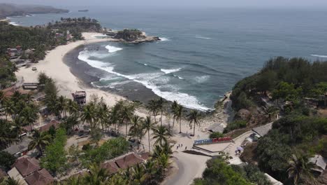 aerial-view-of-Klayar-Beach-which-has-the-charm-of-white-sand-and-beautiful-white-coral-in-Pacitan,-Indonesia