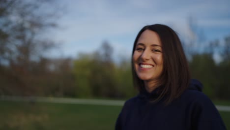 Happy-female-brunette-smile-and-enjoy-life,-outdoor-park,-Czech-Republic