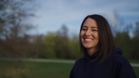 happy female brunette smile and enjoy life, outdoor park, czech republic