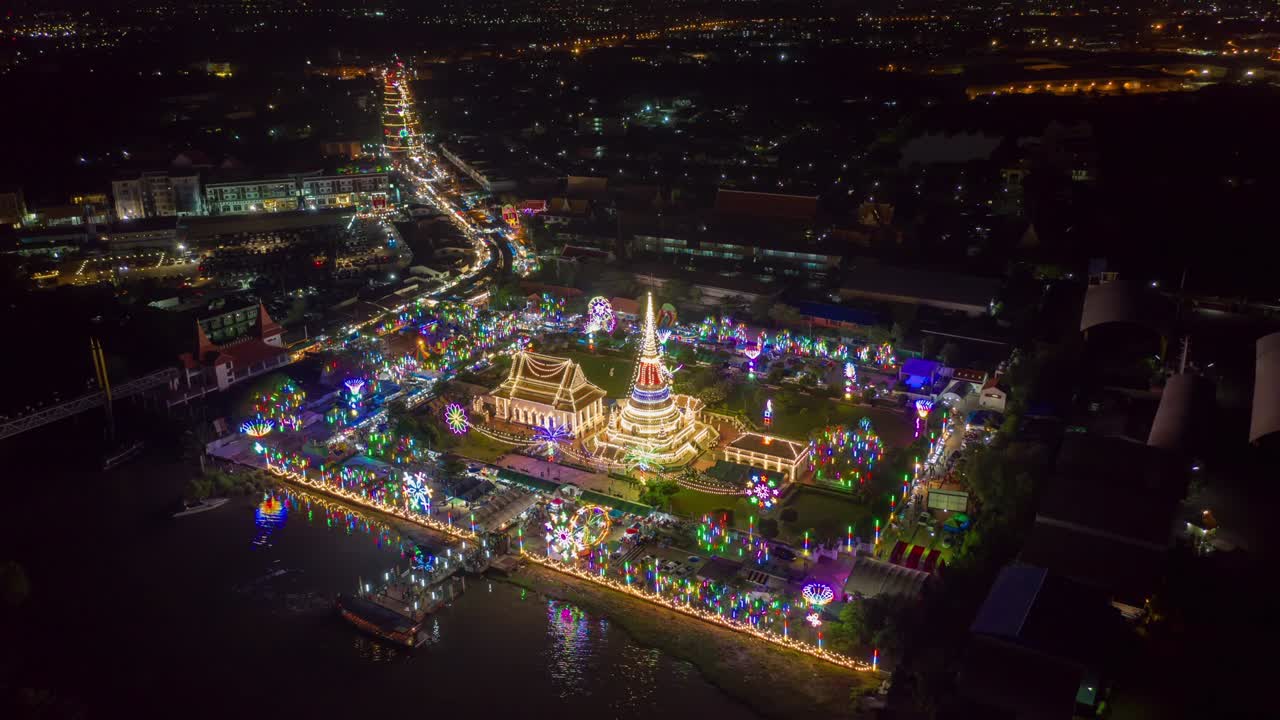 Aerial view night hyper lapse over Phra Samut Chedi(Pagoda) during Phra Samut Chedi festival Samut Prakan Province in Thailand.