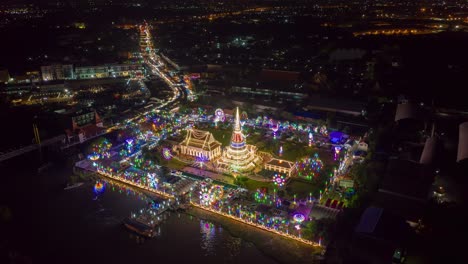 aerial view night hyper lapse over phra samut chedi(pagoda) during phra samut chedi festival samut prakan province in thailand.