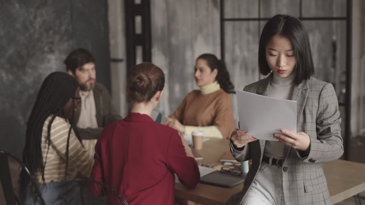 Asian Businesswoman Posing in Conference Room