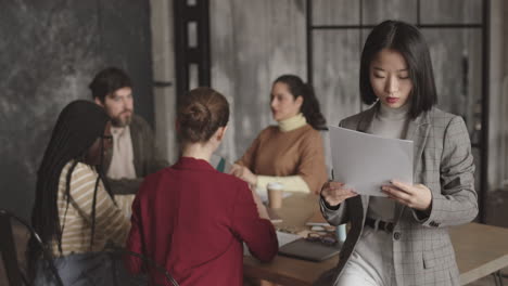 asian businesswoman posing in conference room