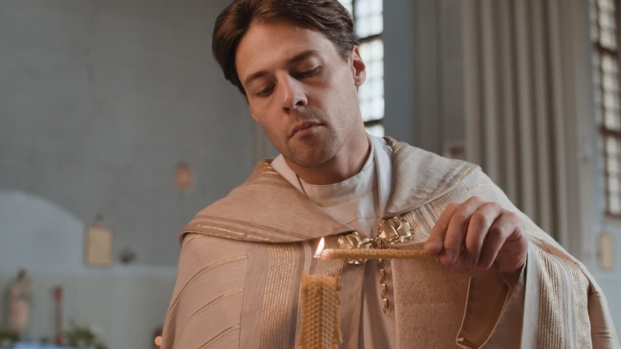 Priest lighting a candle