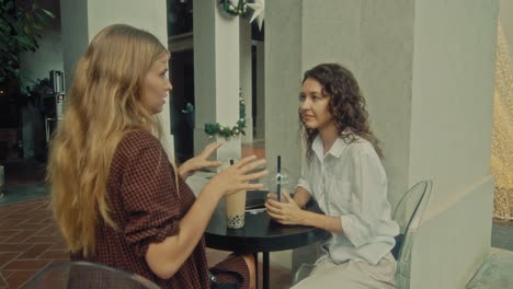 two women friends enjoying bubble tea