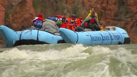 a rafting expedition heads down the colorado river in the grand canyon