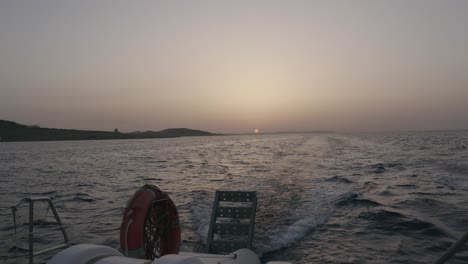 Boat-In-The-Sea-At-Sunset