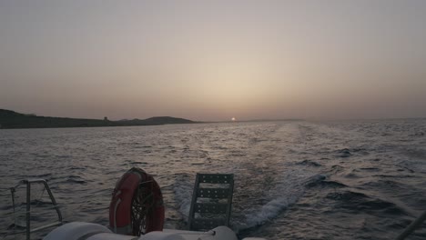 boat in the sea at sunset