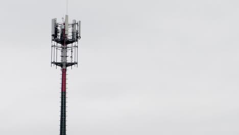 telecommunication tower against a clear sky in an open setting