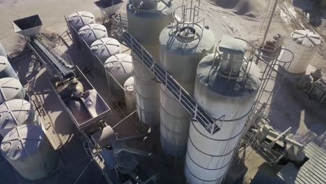 aerial-view-of-a-cement-and-aggregate-factory-showing-silos,-conveyor-belts-and-heavy-machinery